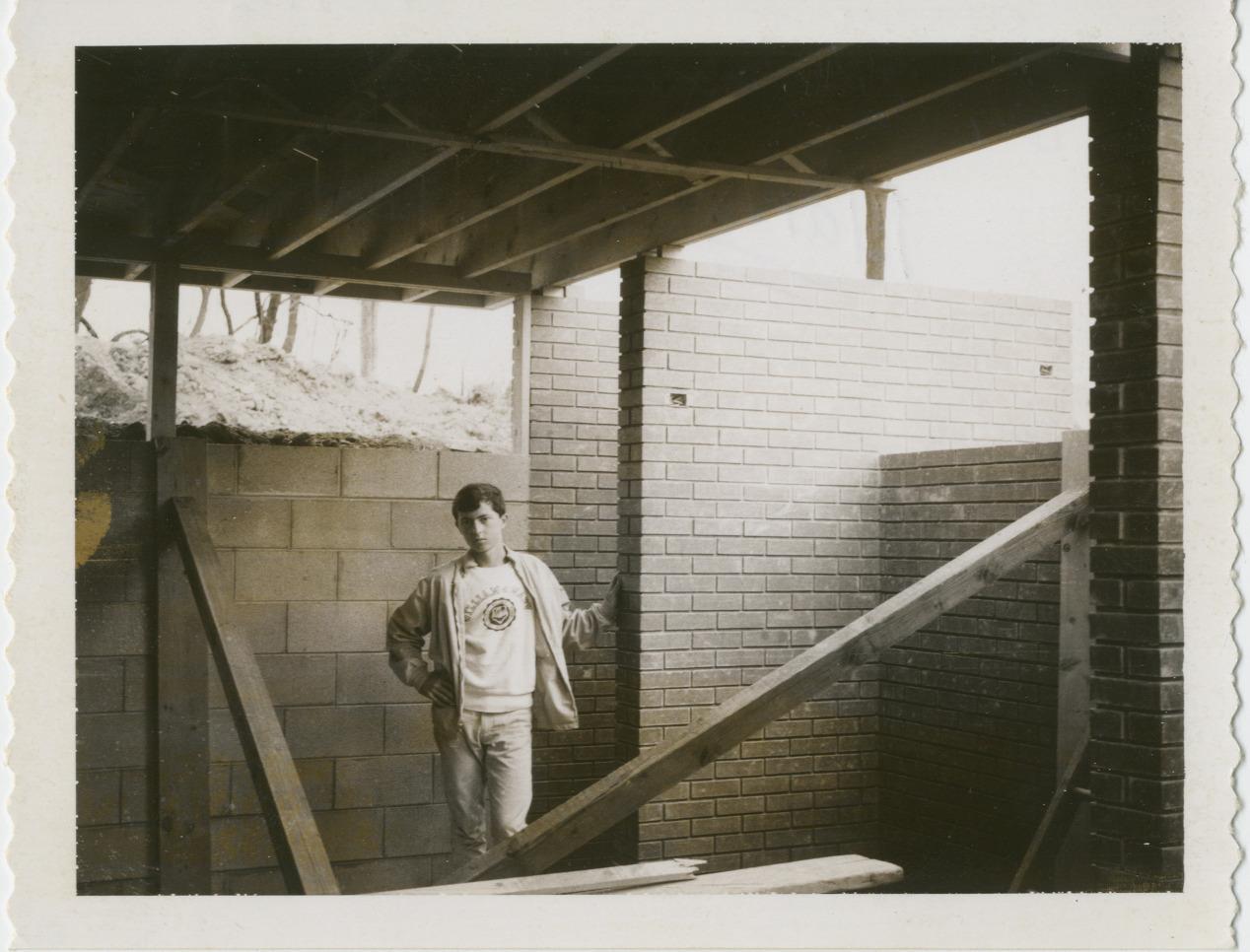 Mark McDougle Standing in 500 Evergreen Circle During its Construction