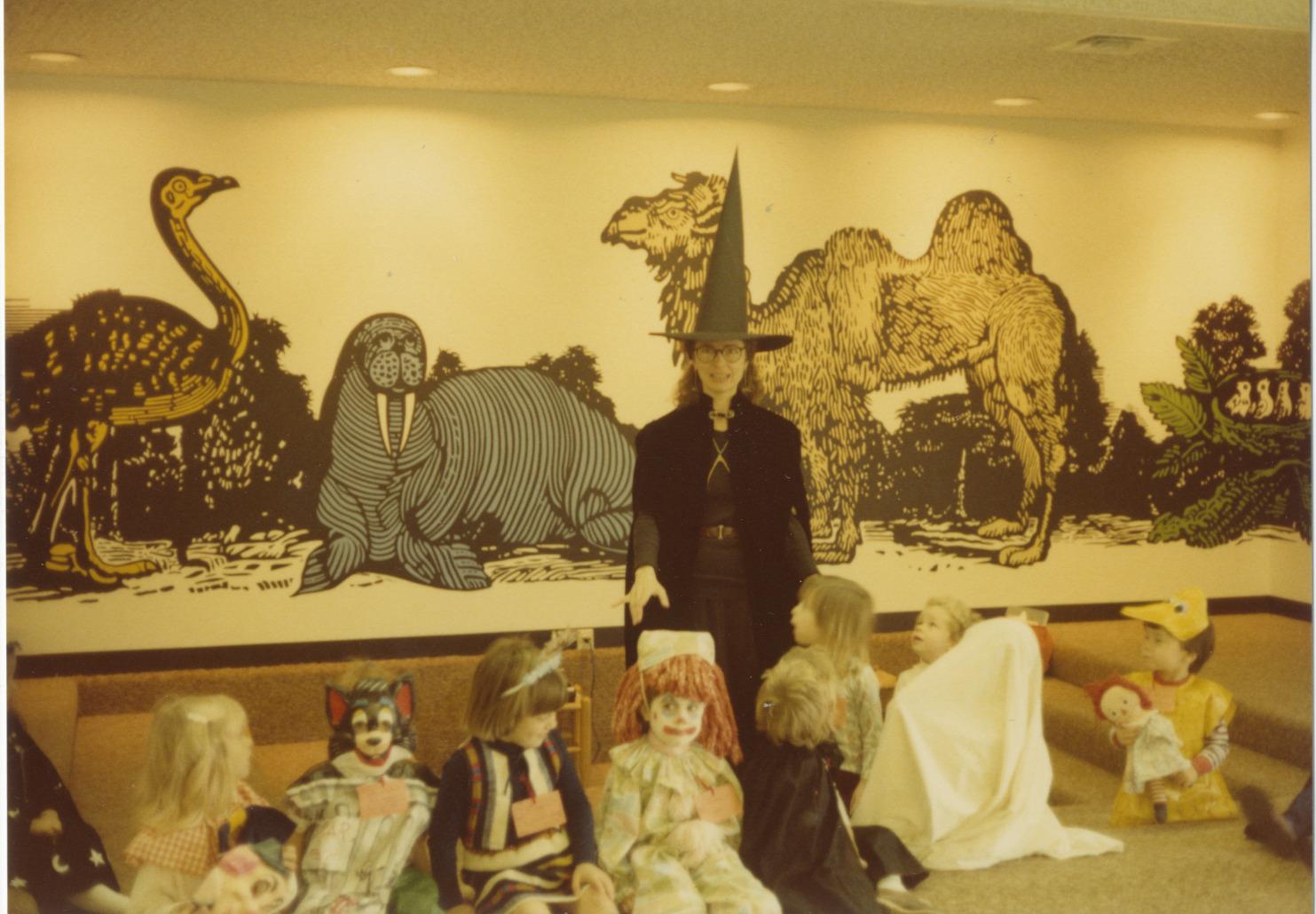 Photograph of Librarian Rachel Alexander with Children at a Halloween Storytime