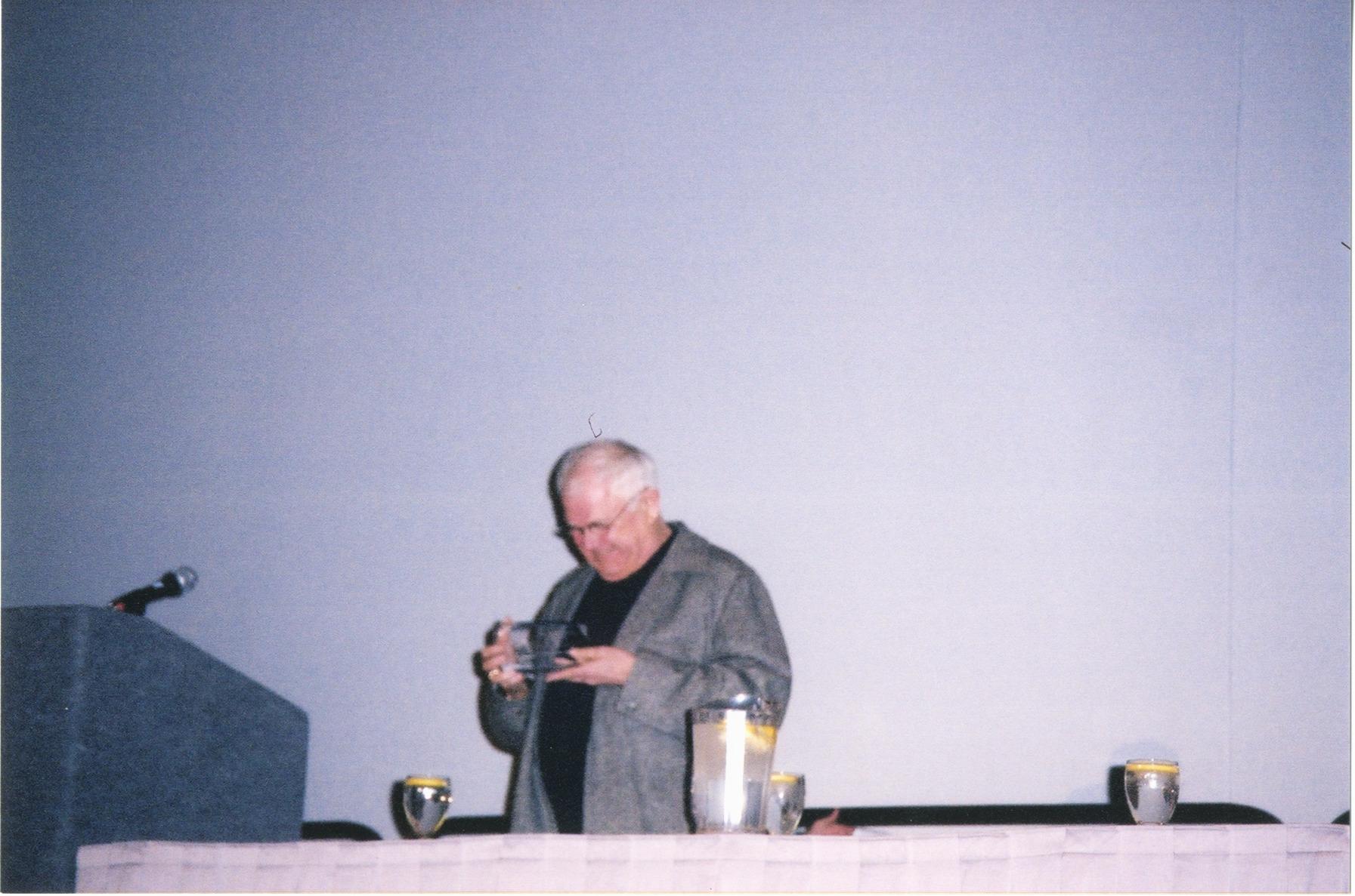 Photograph of Tomie dePaola Accepting the Jo Osborne Award