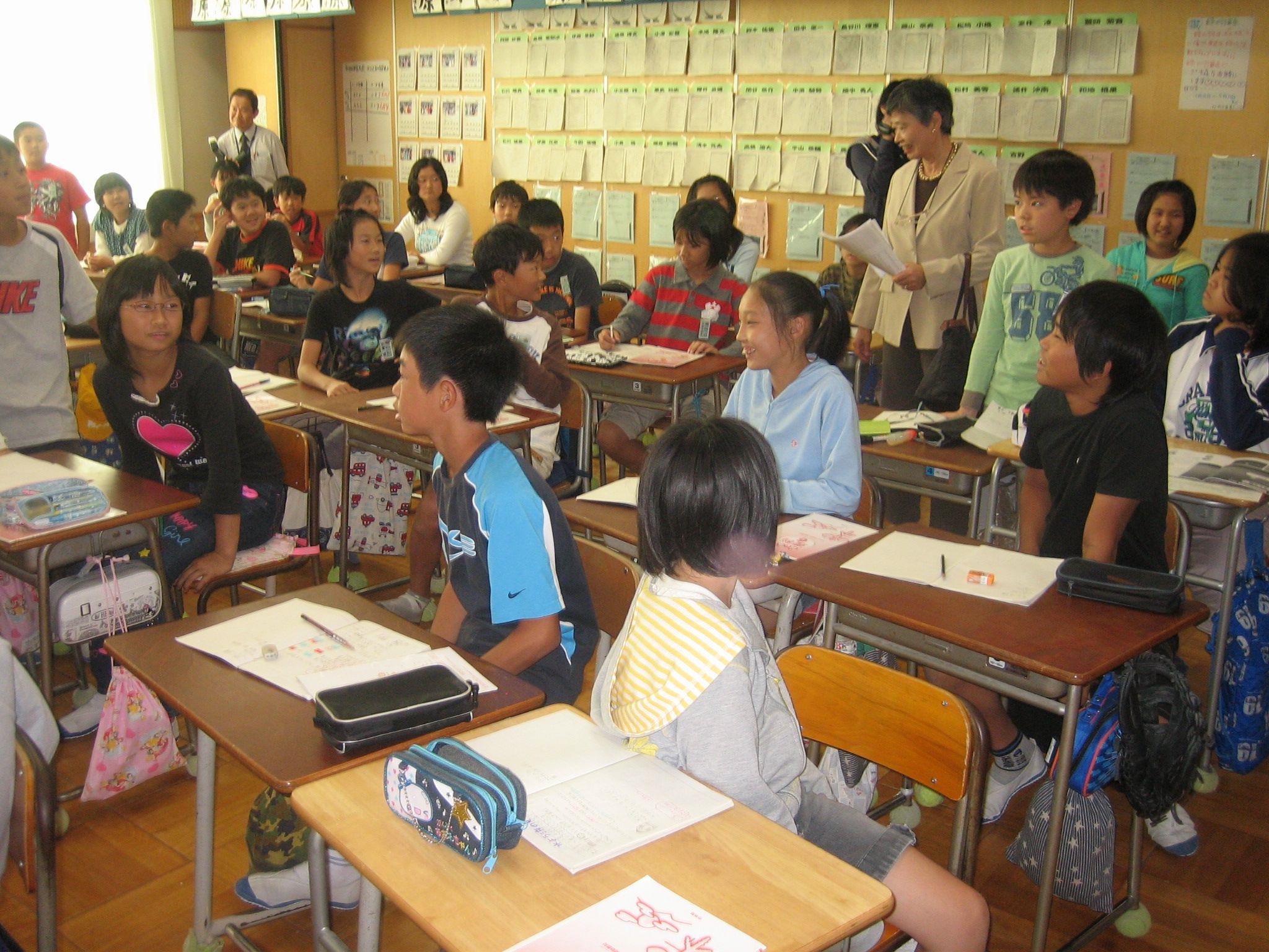 Photograph of teachers and students in a school classroom in Sayama, Japan