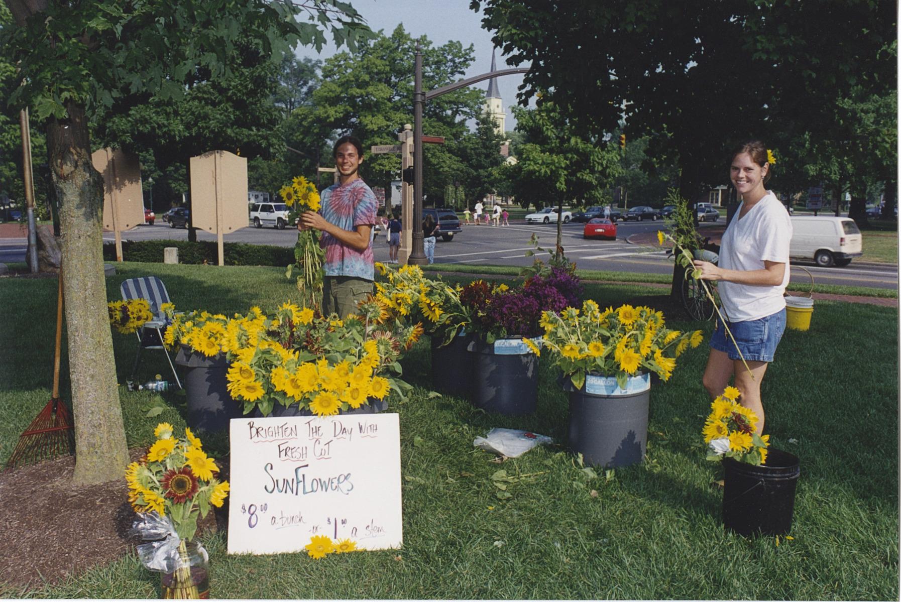 Two Vendors with Sunflowers at the Worthington Farmer's Market