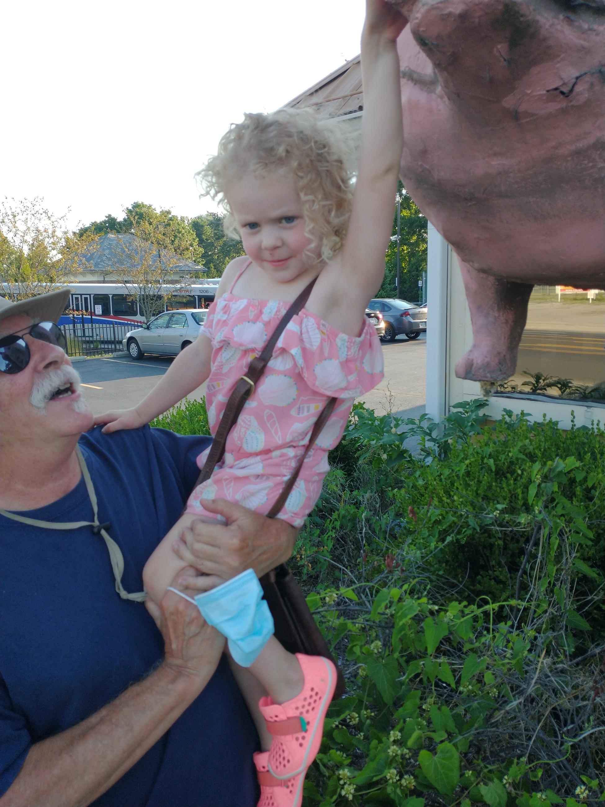 William (bc) (Bill) Collins with Granddaughter at the Iron Grill Pig Statue