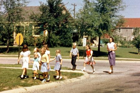 An Adult and Group of Children at the Intersection of Kenbrook Drive and Andover Street, 1950s