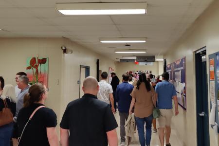 Attendees at the Thomas Worthington High School Alumni Tour, Shown Walking Down a Hallway
