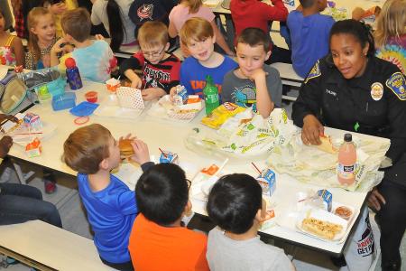 Community Resource Officer Tammy Floyd and Students at “Lunch with an Officer”