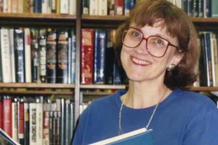 Photograph of Librarian Jo Osborne Holding the Book "Stellaluna"