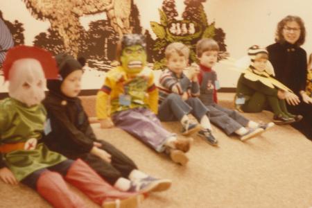 Photograph of Librarian Rachel Alexander with Children at a Halloween Storytime