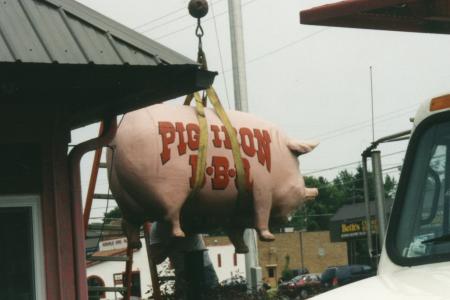 Pig Iron BBQ Pig Statue Being Lifted into Place