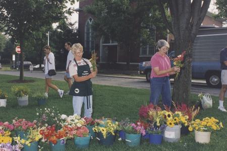 Vendors with Buckets of Flowers at the Worthington Farmer's Market