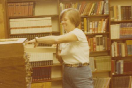 Worthington Public Library Director Bernice Daniels Throwing Away Cards from Card Catalog