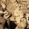 Ellen Gloyd and an Unidentified Child Sitting Outside with Animals