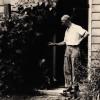 Elmer Gloyd Standing Outside of His Home