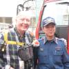Photograph of Harvey Minton with a firefighter in Sayama, Japan