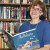 Photograph of Librarian Jo Osborne Holding the Book "Stellaluna"