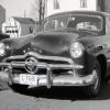 Photograph of Maxine Gail Shirk at Wheel of 1949 Ford Car