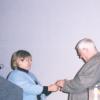Photograph of Sally Oddi Giving the Jo Osborne Award to Tomie dePaola