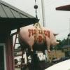 Pig Iron BBQ Pig Statue Being Lifted into Place